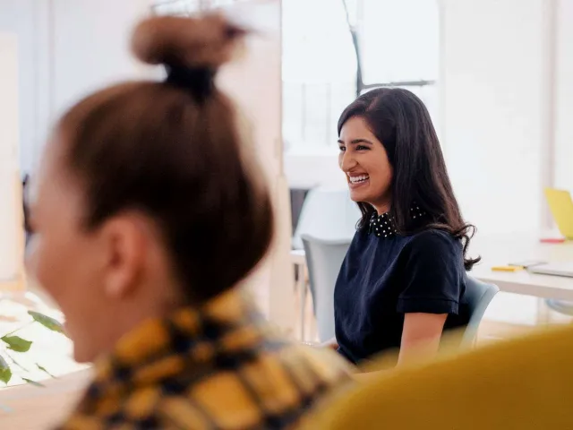 two women smiling together