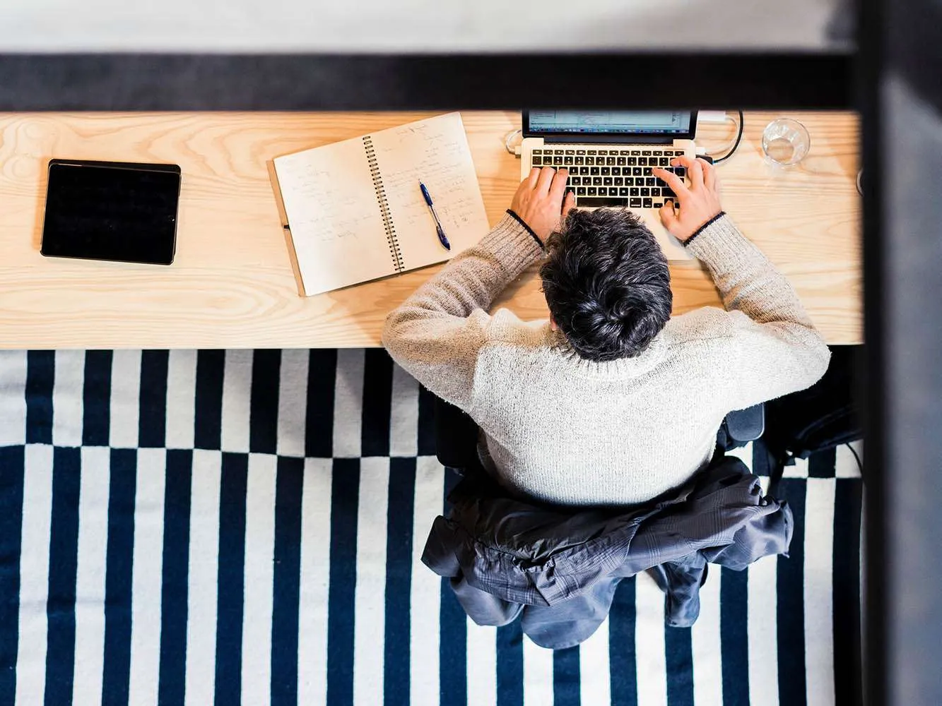 man working on laptop at desk