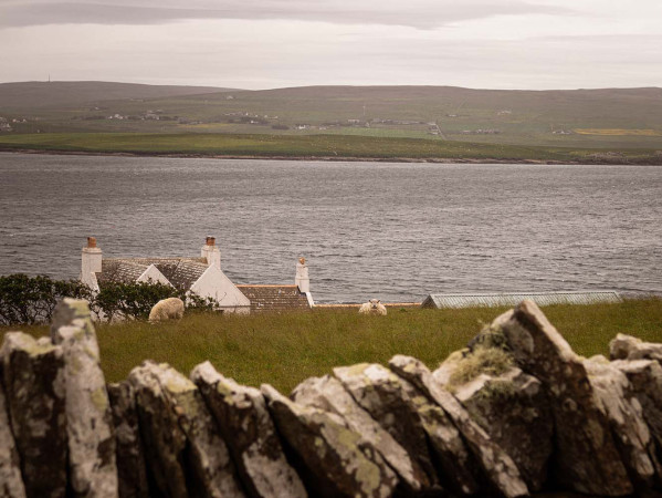 Orkney seascape with houses and mountains