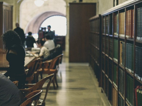 people working in an old fashioned library