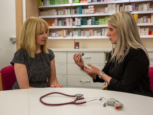 people chatting in a pharmacy