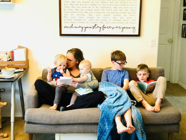 family sat on a sofa